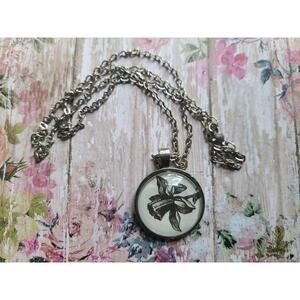 Narcissus pendant necklace made from Touch of Darkness book pages